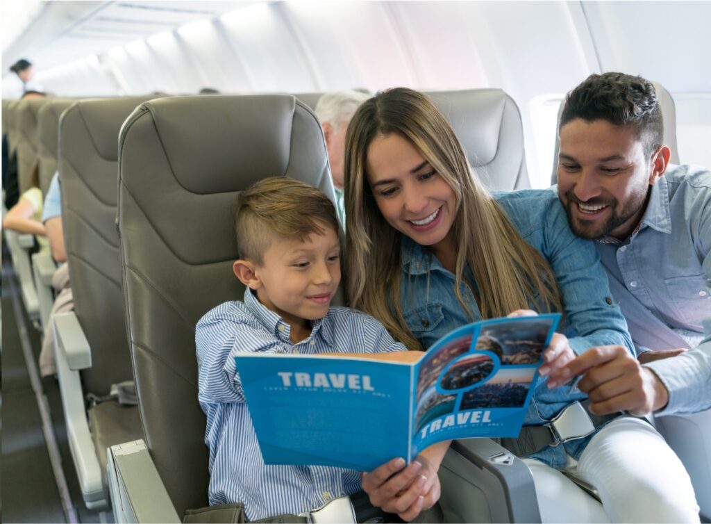 Travelers reading a book with local language phrases highlighted for learning.